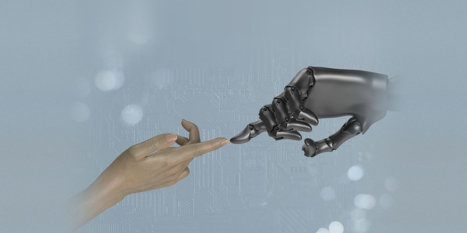 Un doigt humain touche le doigt d’une main robotique, comme dans la Création d’Adam.